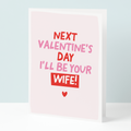 Valentine's Day card with text 'Next Valentine's Day I'll be your wife!' on a light pink background.
