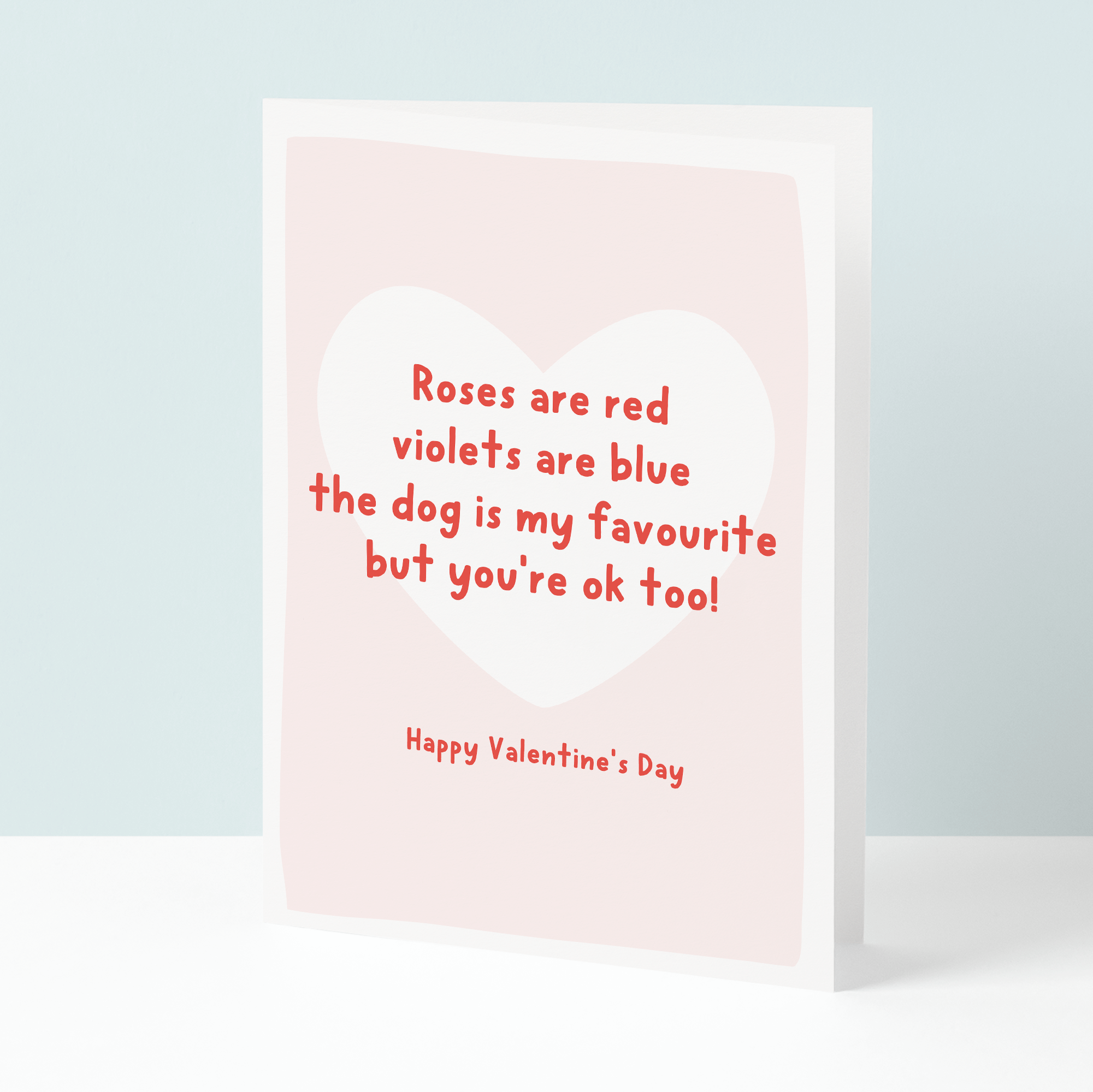 Valentine's Day card with red text on a light pink background